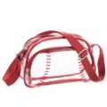 Clear PVC crossbody bag detail featuring red baseball stitching pattern and adjustable red strap. - Red