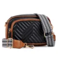 Detailed view of black and brown quilted crossbody bag with wide patterned strap and hardware. - Black Brown