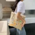 Sac cabas en toile grande capacité décontracté avec broderie élégante et bretelles confortables. - Sac à main / Kaki