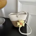 Color block woven bucket bag with fabric flower and pearl decor for stylish daily commuting. - With Charm / White and Khaki
