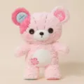 Simpatico orsetto di peluche rosa con occhi a bottone e dettagli cuciti per bambini. - Rosa