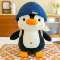 Simpatico peluche pinguino con cappello blu e zaino, morbida bambola di animale farcito regalo. - 23cm / Blu