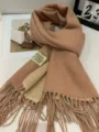 Detailed view of the stylish winter double-sided solid color warm fringe scarf. - Double-Sided Light Camel