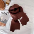 Detailed close-up of the soft brown winter knitted scarf, cozy thermal accessory. - Deep Chestnut