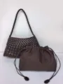 Dark brown woven leather shoulder bag with matching pouch, stylish retro underarm handbag detail. - Coffee