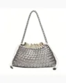 Close-up view of the metallic silver woven leather handbag, highlighting intricate strap texture. - Silver