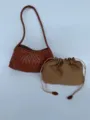 Detailed close-up shot of the brown woven leather shoulder bag and pouch set showing intricate texture. - Tan
