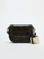 Close-up details of the stylish snake pattern saddle bag with wide strap and hardware. - S / Black