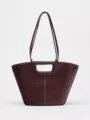 Dark red leather shoulder tote bag with unique cutout handle and contrast white stitching details. - S / Burgundy