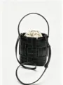 Black woven leather bucket bag with beige drawstring inner pouch, handle and shoulder strap - Black