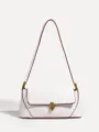 Close-up of white shoulder bag detail showing red contrast edge and brass lock hardware. - White PU