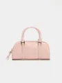 Detailed view of the pink leather boston handbag, showing soft texture and metal hardware. - S / Pink