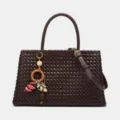 Dark brown woven leather handbag for women, stylish tote shoulder bag with charm pendant. - S / Burgundy
