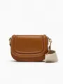 Brown leather saddle bag featuring wide fabric strap and chic magnetic flap closure. - S / Tan