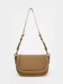 Stylish brown suede saddle bag for women with flap, magnetic snap, and chic stitching details. - S / Camel