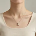 Close-up detail of the stylish smooth puffy letter L stainless steel clavicle chain necklace. - Letter L
