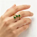 Elegant 18k gold plated open ring featuring three vibrant green oval emerald stones for women. - Ring / Gold