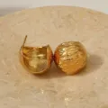 Detailed shot of textured gold C-shape dome earrings, elegant stainless steel jewelry. - Spherical Texture Style (LS-EH)