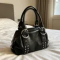 Black vintage PU leather Boston handbag with metal ring and rivet details for women stylish daily use. - Black