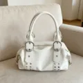 White soft PU leather Boston handbag featuring metal ring buckles and retro underarm style. - White
