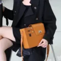 Stylish brown PU leather crossbody bag with built-in tumbler holder for outdoor travel. - Brown
