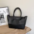 Elegant sac cabas noir pour femme avec double poignees et grande capacite pratique. - Noir