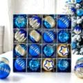 Close-up view of blue and gold Christmas tree baubles in a neat gift box display detail. - Blue Peacock Painted - 16PCS