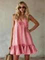 Pink sleeveless V-neck dress detail, featuring front tie and stylish ruffled hemline. - Pink
