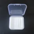 Clear plastic storage box with white foam insert, versatile utility container for small items. - Square Fly Fishing Box / 5.5x5.5x2cm