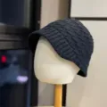 Detailed view of the dark grey knitted winter bucket hat, textured knit fabric closeup. - Adult One Size (54-60cm) / Black