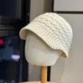 Detailed view of a stylish beige knitted visor winter hat, showing cozy texture and knit pattern. - Adult One Size (54-60cm) / Beige