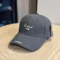 Dark grey embroidered baseball cap with curved brim, stylish streetwear accessory for daily wear. - Adult 54-60 Adjustable / Gray