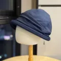Detailed shot of dark blue pleated denim bucket hat, showcasing retro slouchy texture. - Adult Adjustable 54-60 / Navy Blue