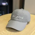 Detail view of a stylish grey cotton baseball cap with white New york embroidered lettering. - Adult 54-60 Adjustable / Gray