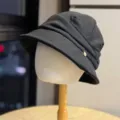 Detail view of black pleated bucket hat, stylish short brim design for women autumn wear - Adult Adjustable 54-60 / Black