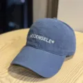 Classic washed baseball hat in stylish blue, featuring a curved brim and casual streetwear appeal. - Adult 54-60 Adjustable / Navy Blue