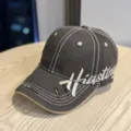 Detailed view of vintage embroidered baseball hat showing contrast stitching and distressed brim. - Adult 54-60 Adjustable / Coffee