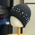 Detailed view of a stylish black knitted beanie featuring sparkling rhinestones and black beads. - Adult One Size (54-60cm) / Black