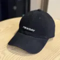 Close-up detail of a black washed cotton baseball cap with embroidered front lettering. - Adult 54-60 Adjustable / Black