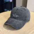 Washed cotton baseball cap with stylish front white embroidery phrase, casual daily sun hat. - Adult 54-60 Adjustable / Black