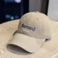 Detailed view of the khaki embroidered baseball cap with stylish blue letters for daily wear. - Khaki