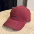Burgundy washed cotton baseball cap with embroidered NEWDAY text, wide brim vintage style. - Adult 54-60 Adjustable / Burgundy