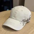 Casual beige baseball cap with side embroidery, curved brim, stylish sun protection hat. - Adult 54-60 Adjustable / Beige