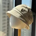 Close-up detail of the vintage pleated suede bucket hat showing texture and fine brim craftsmanship. - Adult Adjustable 54-60 / Beige