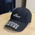 Black washed vintage baseball cap with letter embroidery, distressed street style design. - Adult 54-60 Adjustable / Black
