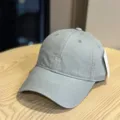 Close-up detail view of the grey washed cotton baseball cap with front embroidery. - Adult 54-60 Adjustable / Light Gray