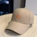 Detailed shot of beige embroidered baseball cap with stylish front text, casual curved brim. - 54-60cm (Adjustable) / Embroidered Letter Style (1707) / Khaki