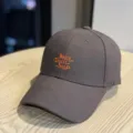 Close-up of dark grey baseball cap with orange 'Baby Don't Stop' embroidery lettering. - 54-60cm (Adjustable) / Embroidered Letter Style (1707) / Coffee