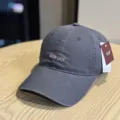 Detail view of dark grey washed cotton baseball cap with stylish front text embroidery. - Adult 54-60 Adjustable / Dark Gray
