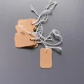 Blank kraft paper hang tags with elastic strings, ideal for DIY pricing, labeling, and notes. - 1.5x2.5cm / Coffee